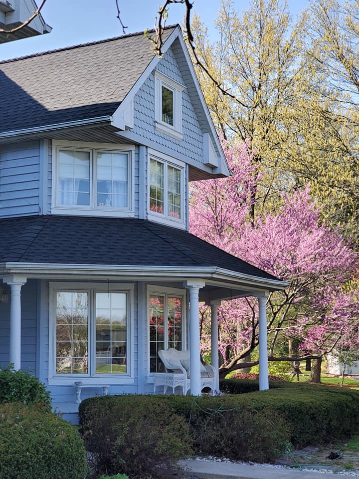 Home in the Metro East with completed siding and a new architectural shingle roof