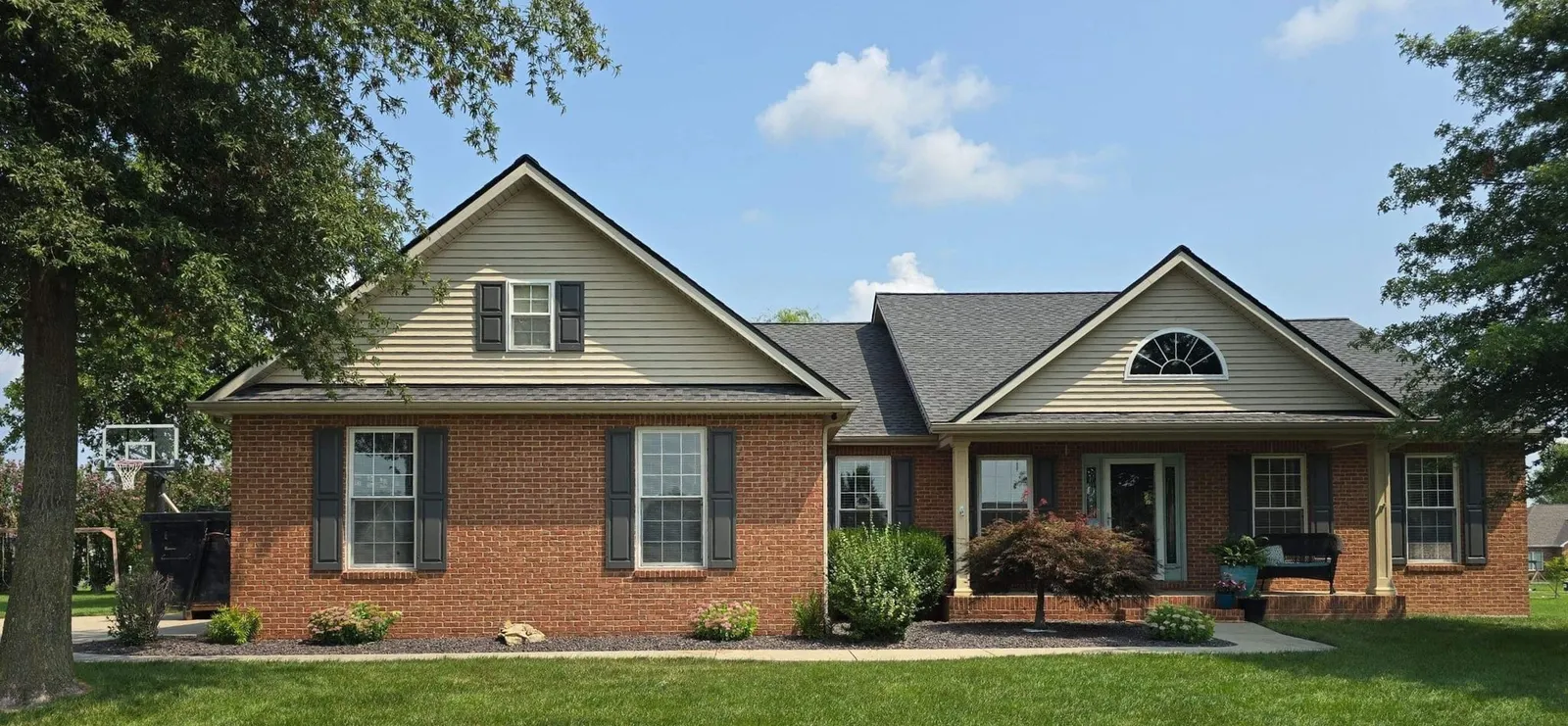 New shingle roof on a brick ranch home with tan gables in Freeburg, IL