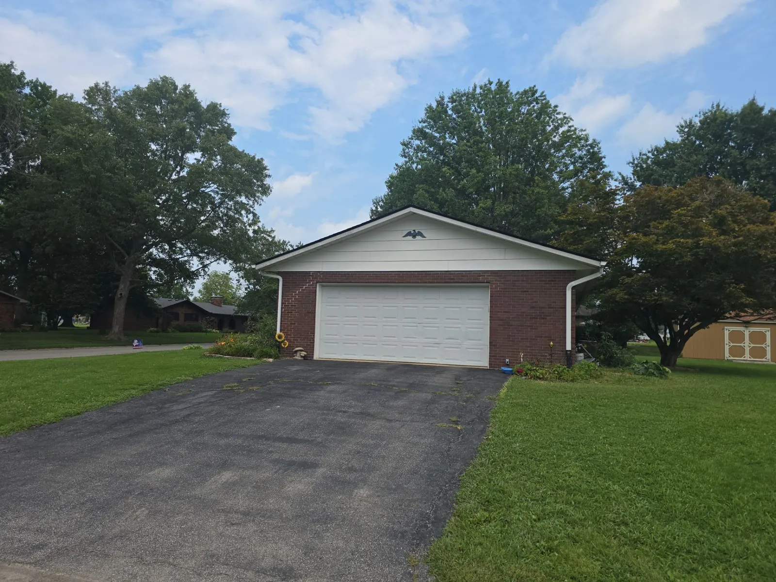 New shingle roof on a brick ranch home with an attached garage in New Athens, IL